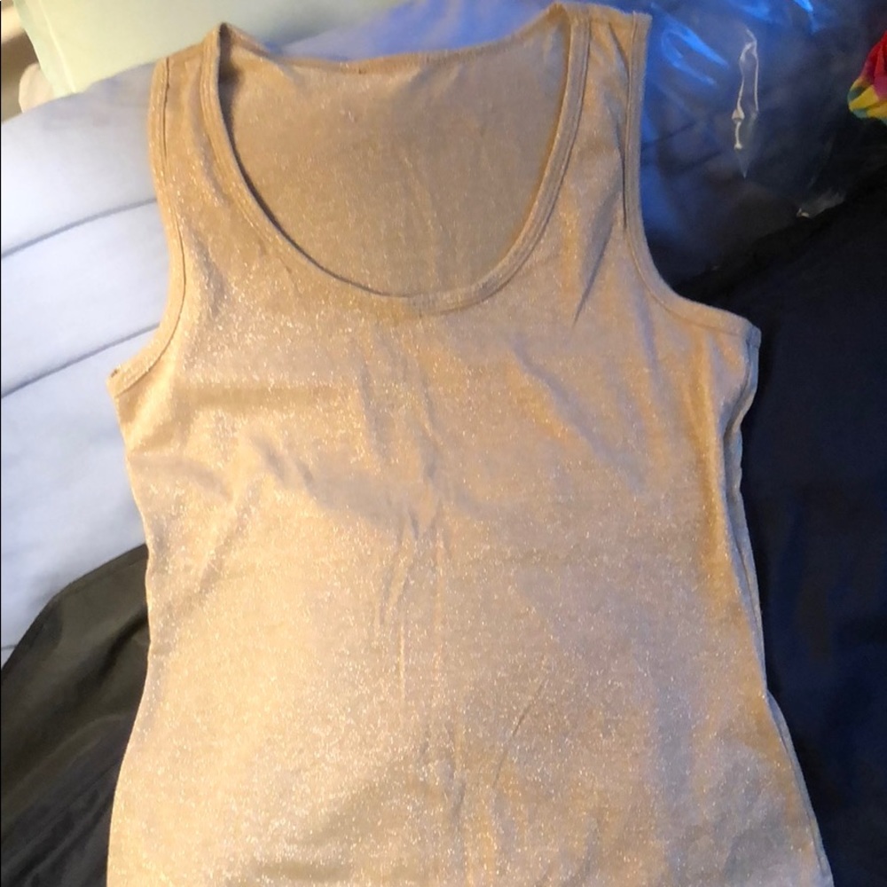 Sparkly gold tank top. Lined in top.